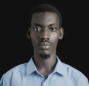 Adam Abdullahi, photographed against a black background